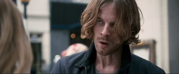 Movie still from “A Street Cat Named Bob” (2016), directed by Roger Spottiswoode – A person with long hair; Close Up shot, Over the shoulder angle