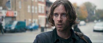 Movie still from “A Street Cat Named Bob” (2016), directed by Roger Spottiswoode – A person with long hair; Close Up shot, Over the shoulder angle