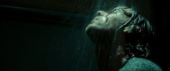 Movie still from “A Street Cat Named Bob” (2016), directed by Roger Spottiswoode – A woman is taking a shower in a dark room; Close Up shot, Low angle