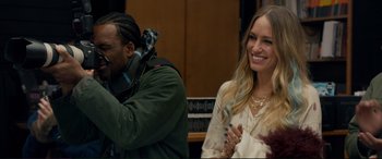 Movie still from “A Street Cat Named Bob” (2016), directed by Roger Spottiswoode – A woman sitting next to a man in a courtroom; Close Up shot, Over the shoulder angle