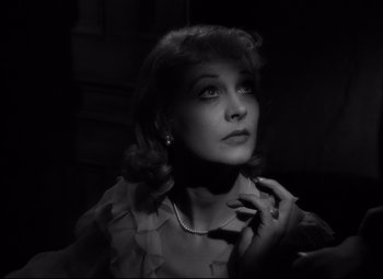 Movie still from “A Streetcar Named Desire” (1951), directed by Elia Kazan – A black - and - white photo of a woman looking up; Close Up shot, Low angle