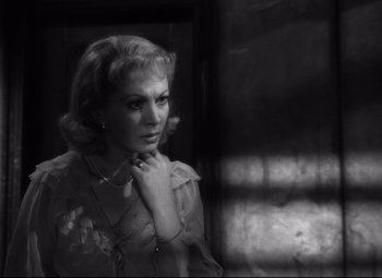 Movie still from “A Streetcar Named Desire” (1951), directed by Elia Kazan – A black - and - white photo of a woman looking at the camera; Close Up shot, High angle