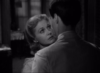 Movie still from “A Streetcar Named Desire” (1951), directed by Elia Kazan – An old photo of a woman and a young man; Close Up shot, Over the shoulder angle