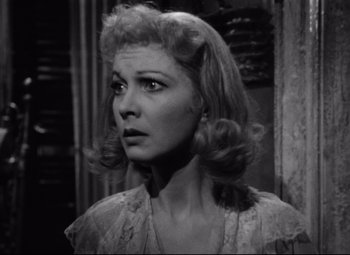 Movie still from “A Streetcar Named Desire” (1951), directed by Elia Kazan – A black and white photo of a woman in a lace dress; Close Up shot, Low angle