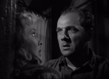 Movie still from “A Streetcar Named Desire” (1951), directed by Elia Kazan – A man and a woman looking at each other; Close Up shot, Low angle