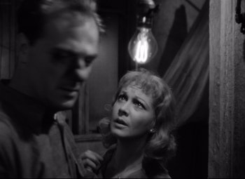 Movie still from “A Streetcar Named Desire” (1951), directed by Elia Kazan – A man and a woman standing next to each other in a room; Close Up shot, Over the shoulder angle