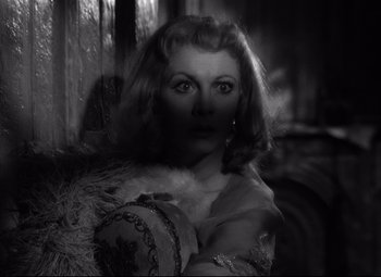 Movie still from “A Streetcar Named Desire” (1951), directed by Elia Kazan – A black and white photo of a woman in a dress; Close Up shot, Low angle