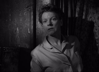 Movie still from “A Streetcar Named Desire” (1951), directed by Elia Kazan – A black and white photo of a woman in a robe; Close Up shot, Low angle