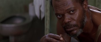 Movie still from “A Time to Kill” (1996), directed by Joel Schumacher – A person with his hand on his chin; Close Up shot, Low angle