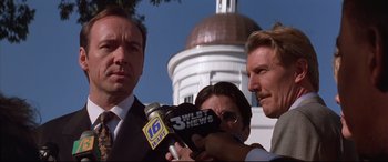 Movie still from “A Time to Kill” (1996), directed by Joel Schumacher – A man is being interviewed by a news reporter; Close Up shot, Low angle