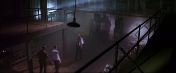 Movie still from “A Time to Kill” (1996), directed by Joel Schumacher – A group of people standing in a room; Extreme Wide shot, High angle