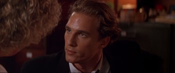 Movie still from “A Time to Kill” (1996), directed by Joel Schumacher – A person wearing a suit and tie; Close Up shot, Over the shoulder angle