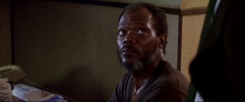 Movie still from “A Time to Kill” (1996), directed by Joel Schumacher – A person with a beard; Close Up shot, Low angle