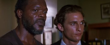 Movie still from “A Time to Kill” (1996), directed by Joel Schumacher – A man and an older black man standing next to each other in a room; Close Up shot, Low angle