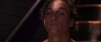 Movie still from “A Time to Kill” (1996), directed by Joel Schumacher – A man's face in the dark; Close Up shot, Low angle