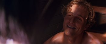 Movie still from “A Time to Kill” (1996), directed by Joel Schumacher – A person with a smile on his face; Close Up shot, Over the shoulder angle