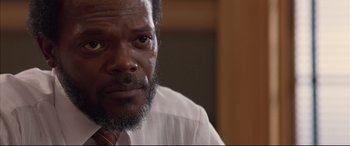 Movie still from “A Time to Kill” (1996), directed by Joel Schumacher – A person wearing a shirt and tie; Close Up shot, Low angle