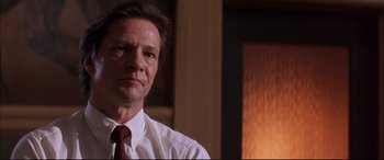 Movie still from “A Time to Kill” (1996), directed by Joel Schumacher – A person wearing a shirt and a tie; Close Up shot, Low angle