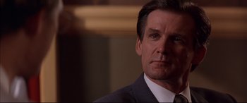 Movie still from “A Time to Kill” (1996), directed by Joel Schumacher – A man in a suit and tie; Close Up shot, Low angle
