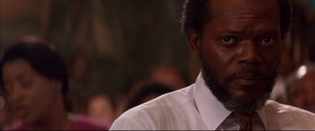 Movie still from “A Time to Kill” (1996), directed by Joel Schumacher – A person wearing a shirt and tie; Close Up shot, Low angle