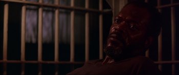 Movie still from “A Time to Kill” (1996), directed by Joel Schumacher – A person in a jail cell; Close Up shot, High angle