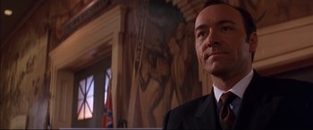 Movie still from “A Time to Kill” (1996), directed by Joel Schumacher – A person wearing a suit and tie; Close Up shot, Low angle