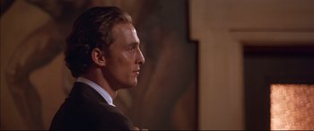 Movie still from “A Time to Kill” (1996), directed by Joel Schumacher – A person wearing a suit and tie; Close Up shot, Over the shoulder angle