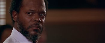 Movie still from “A Time to Kill” (1996), directed by Joel Schumacher – A person with a beard; Close Up shot, Low angle