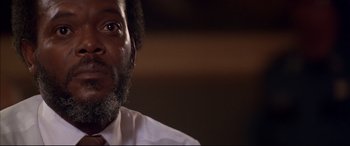 Movie still from “A Time to Kill” (1996), directed by Joel Schumacher – A person wearing a white shirt; Close Up shot, Low angle