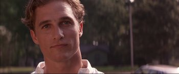 Movie still from “A Time to Kill” (1996), directed by Joel Schumacher – Close up of a man's face with trees in the background; Close Up shot, Over the shoulder angle