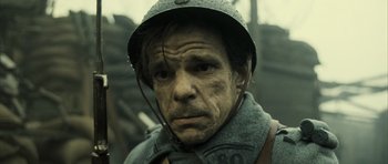 Movie still from “A Very Long Engagement” (2004), directed by Jean-Pierre Jeunet – An old man wearing a helmet and a uniform; Close Up shot, High angle