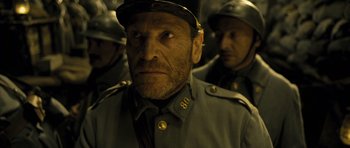 Movie still from “A Very Long Engagement” (2004), directed by Jean-Pierre Jeunet – A group of men in military uniforms standing next to each other; Close Up shot, Low angle