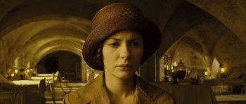 Movie still from “A Very Long Engagement” (2004), directed by Jean-Pierre Jeunet – A person wearing a hat; Close Up shot, High angle