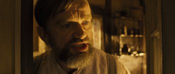 Movie still from “A Very Long Engagement” (2004), directed by Jean-Pierre Jeunet – An old man with a beard and a mustache; Close Up shot, Low angle