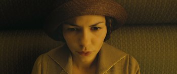 Movie still from “A Very Long Engagement” (2004), directed by Jean-Pierre Jeunet – A person wearing a hat; Close Up shot, High angle