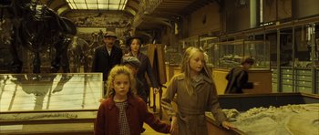 Movie still from “A Very Long Engagement” (2004), directed by Jean-Pierre Jeunet – A group of people walking in a room; Medium shot, High angle