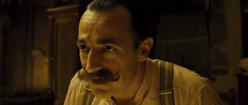 Movie still from “A Very Long Engagement” (2004), directed by Jean-Pierre Jeunet – A person with a mustache; Close Up shot, Low angle