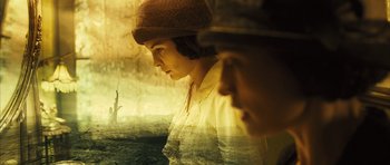 Movie still from “A Very Long Engagement” (2004), directed by Jean-Pierre Jeunet – A woman wearing a brown hat and a white shirt; Close Up shot, Low angle