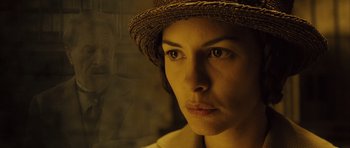 Movie still from “A Very Long Engagement” (2004), directed by Jean-Pierre Jeunet – A person wearing a hat; Close Up shot, Over the shoulder angle