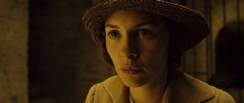 Movie still from “A Very Long Engagement” (2004), directed by Jean-Pierre Jeunet – A person wearing a hat; Close Up shot, High angle