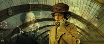 Movie still from “A Very Long Engagement” (2004), directed by Jean-Pierre Jeunet – A woman wearing a hat talking on a phone; Close Up shot, Low angle