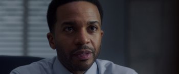 Movie still from “A Wrinkle in Time” (2018), directed by Ava DuVernay – A person wearing a shirt and tie; Close Up shot, Over the shoulder angle