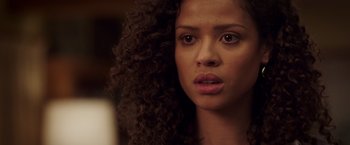 Movie still from “A Wrinkle in Time” (2018), directed by Ava DuVernay – A person with curly brown hair; Close Up shot, Over the shoulder angle