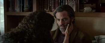 Movie still from “A Wrinkle in Time” (2018), directed by Ava DuVernay – A man and a woman talking in front of a book shelf; Close Up shot, Over the shoulder angle