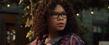Movie still from “A Wrinkle in Time” (2018), directed by Ava DuVernay – A woman with glasses and a plaid shirt looking to her left; Close Up shot, Low angle