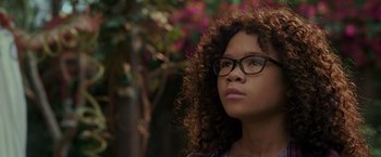 Movie still from “A Wrinkle in Time” (2018), directed by Ava DuVernay – A woman with glasses looking up at the sky; Close Up shot, Low angle