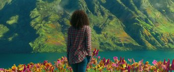 Movie still from “A Wrinkle in Time” (2018), directed by Ava DuVernay – A woman standing in front of a body of water; Wide shot, High angle