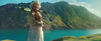 Movie still from “A Wrinkle in Time” (2018), directed by Ava DuVernay – An image of a woman standing in front of a lake; Medium shot, Low angle