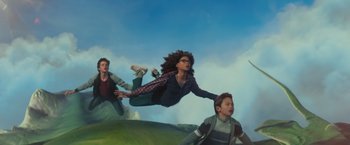 Movie still from “A Wrinkle in Time” (2018), directed by Ava DuVernay – A group of people flying through the air on top of a hill; Wide shot, Low angle