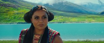 Movie still from “A Wrinkle in Time” (2018), directed by Ava DuVernay – A woman in a hat and a colorful outfit near a body of water; Close Up shot, Over the shoulder angle